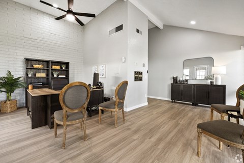 an open living room with a dining room table and chairs